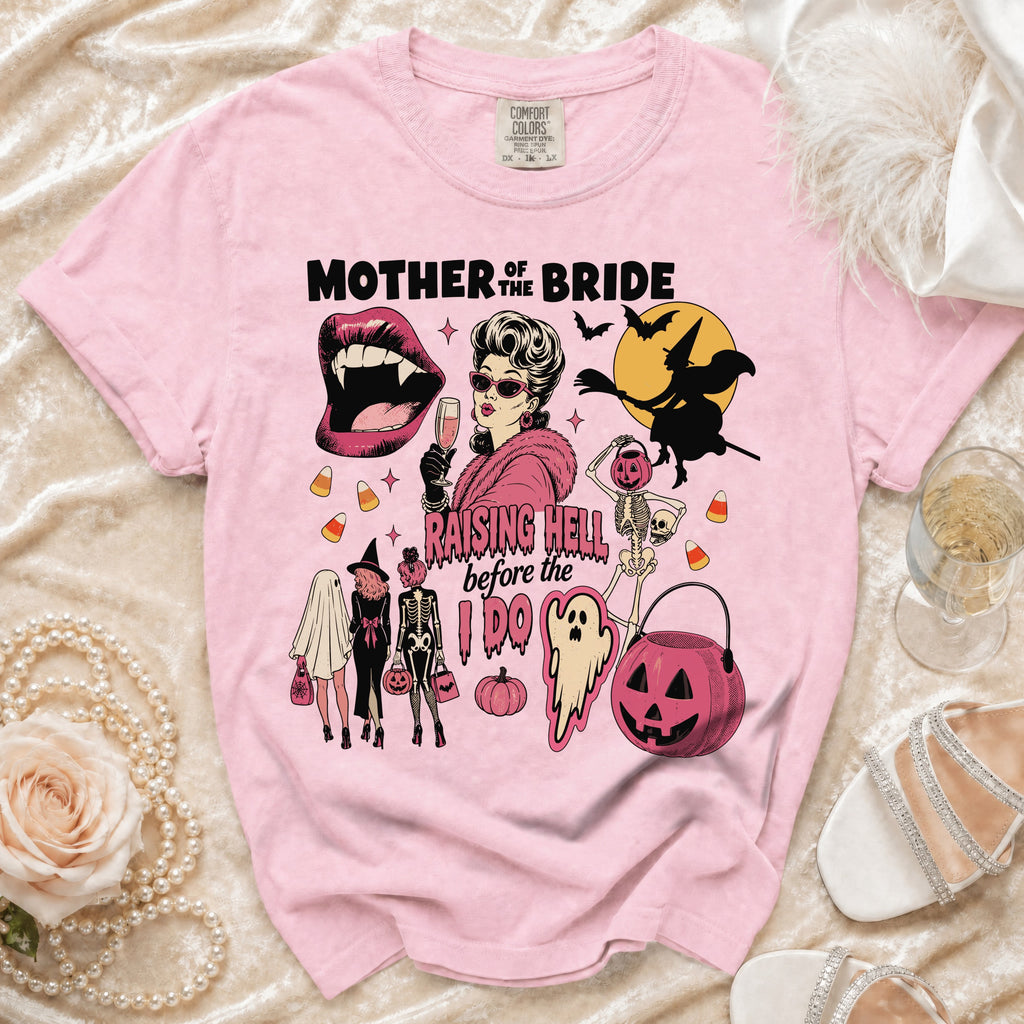 Pink t-shirt with "Mother of the Bride Raising Hell Before the I Do" Halloween graphic.