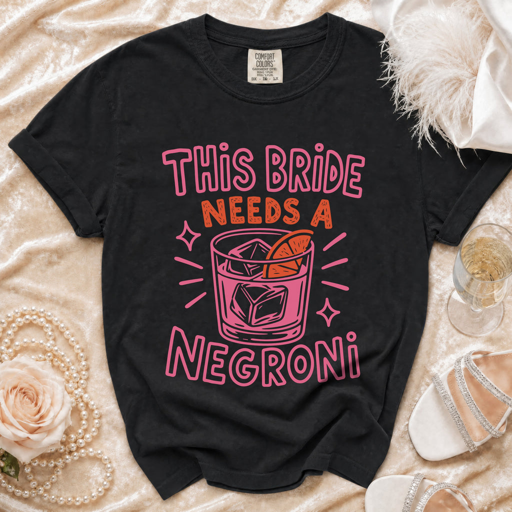 Black t-shirt with "This Bride Needs a Negroni" text and cocktail graphic.