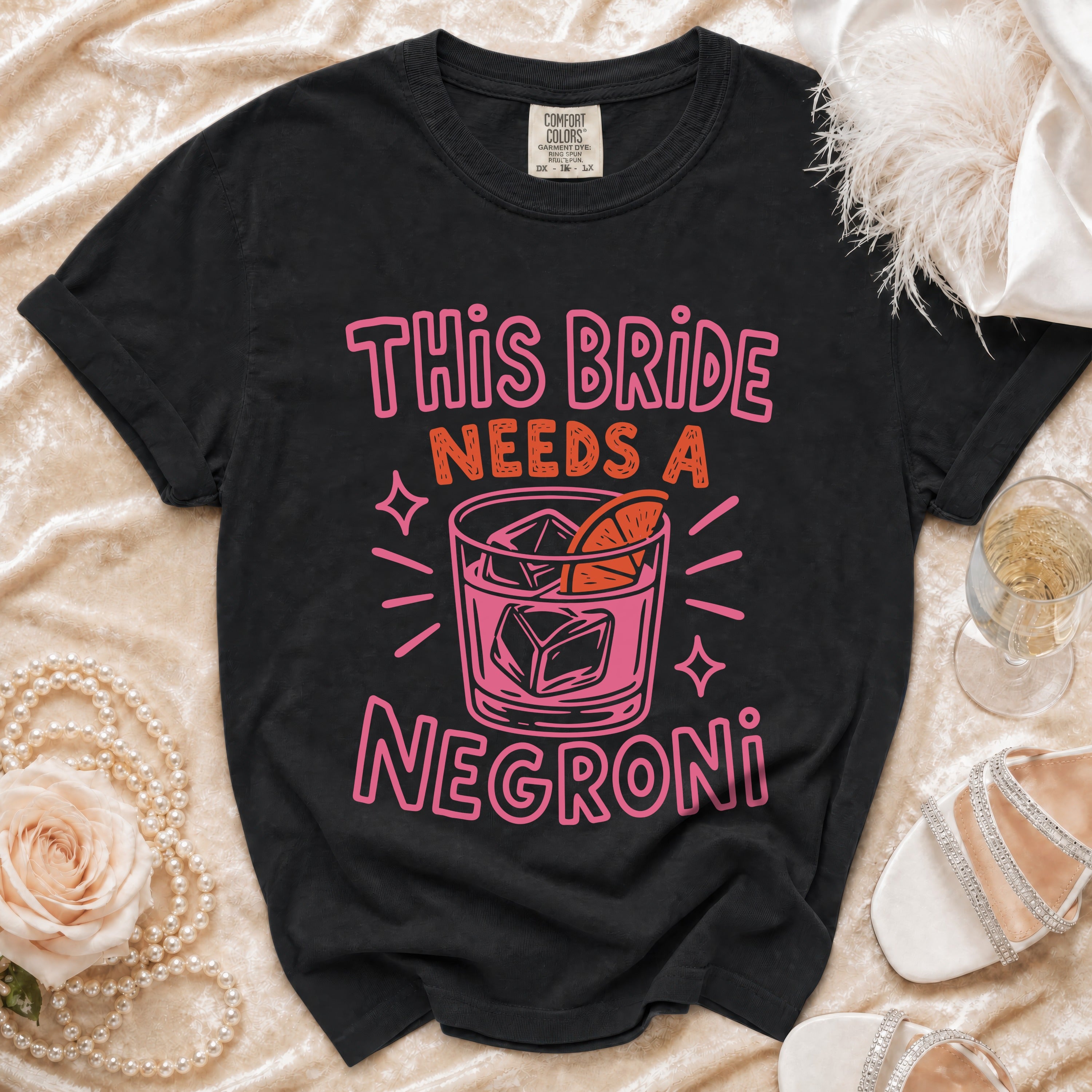 Black t-shirt with "This Bride Needs a Negroni" text and cocktail graphic.