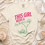 Cream t-shirt with pink text "THIS GIRL NEEDS A Spicy Margi".