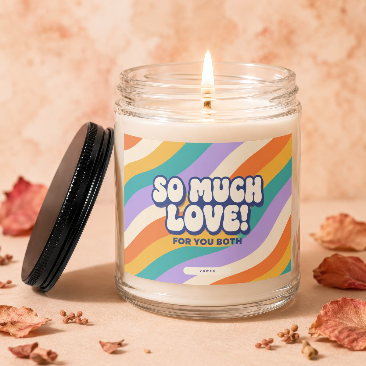 Candle with "SO MUCH LOVE! FOR YOU BOTH" text on a groovy rainbow label.