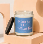 Glass candle with blue label reading "I Can't Say 'I Do' Without You VOWED".