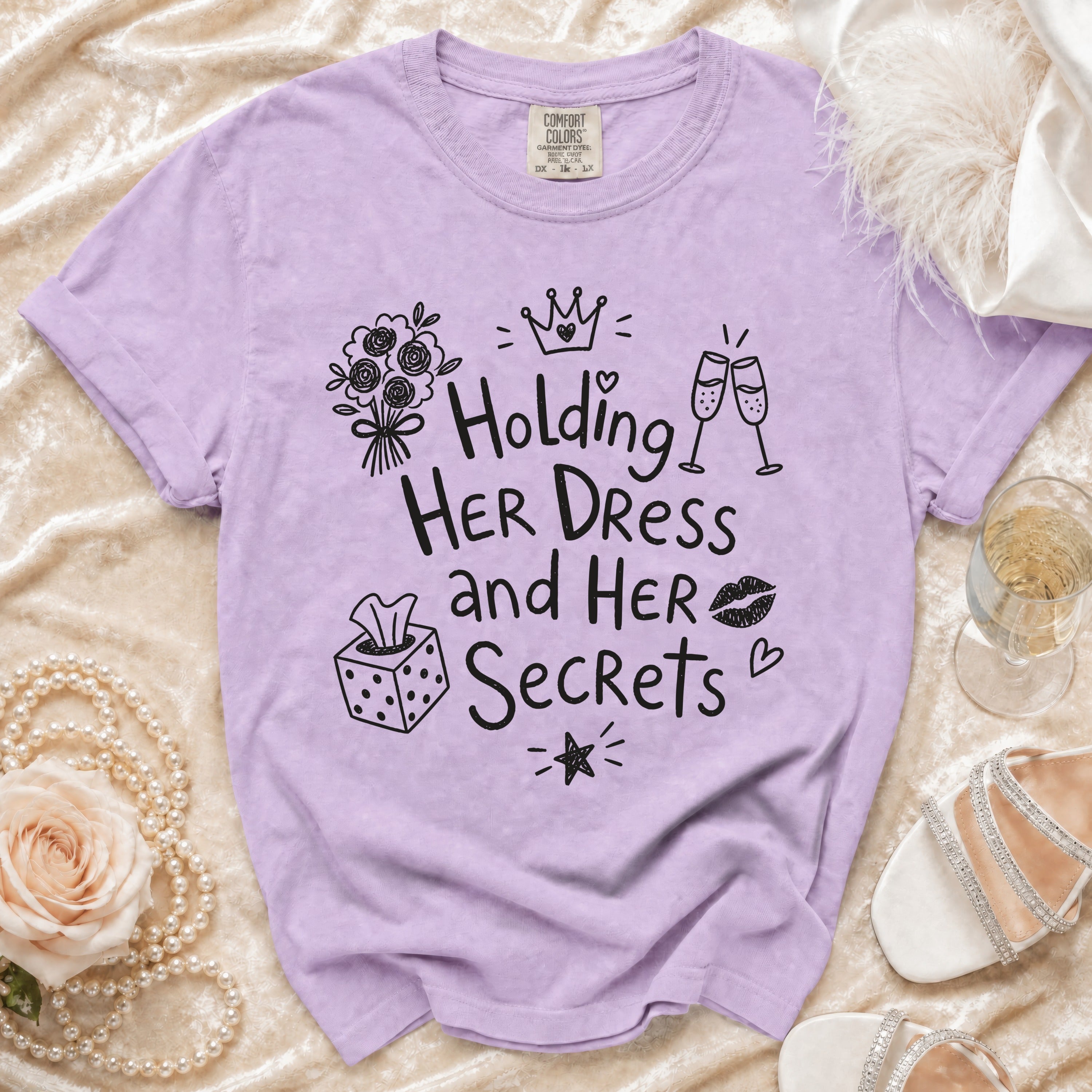 Comfort Colors t-shirt with "Holding Her Dress and Her Secrets" graphic.