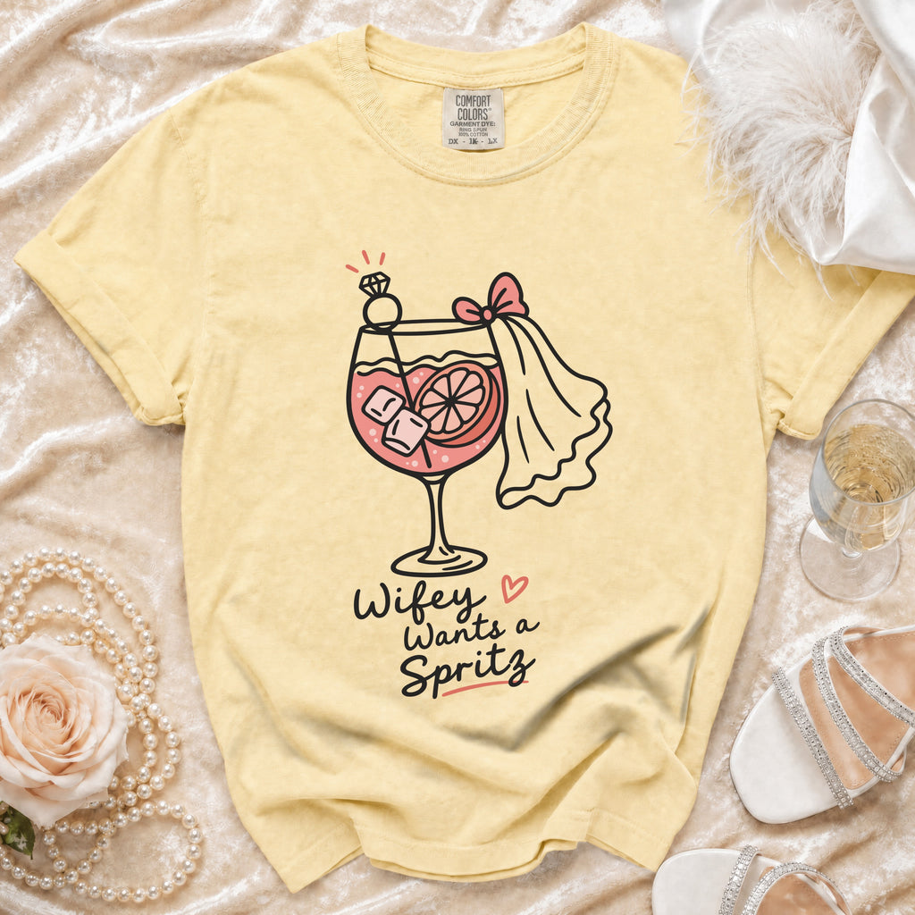 Yellow t-shirt with "Wifey Wants a Spritz" and cocktail graphic.