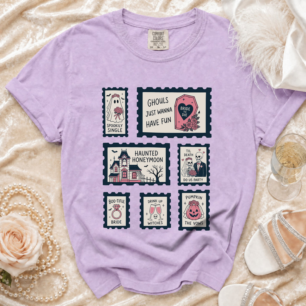 Purple t-shirt with six Halloween-themed wedding stamps: "Spookily Single," "Ghouls Just Wanna Have Fun," "Haunted Honeymoon," "Til Death Do Us Party," "Boo-tiful Bride," and "Pumpkin the Vows."