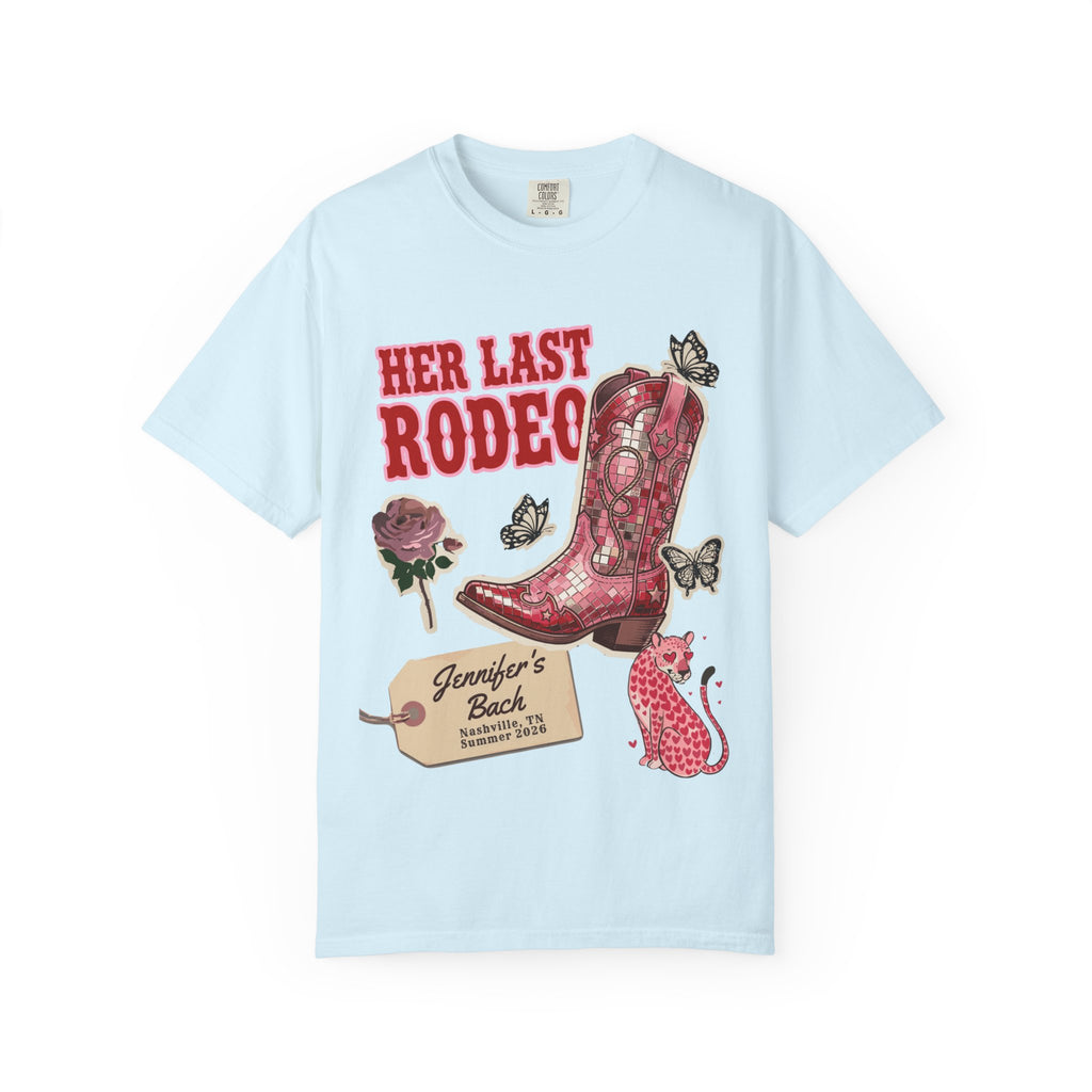 Light blue t-shirt with "Her Last Rodeo" text and a decorated cowboy boot.