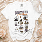 White t-shirt with "Mother of the Bride Surviving the Horror, One Wedding at a Time!" graphic.