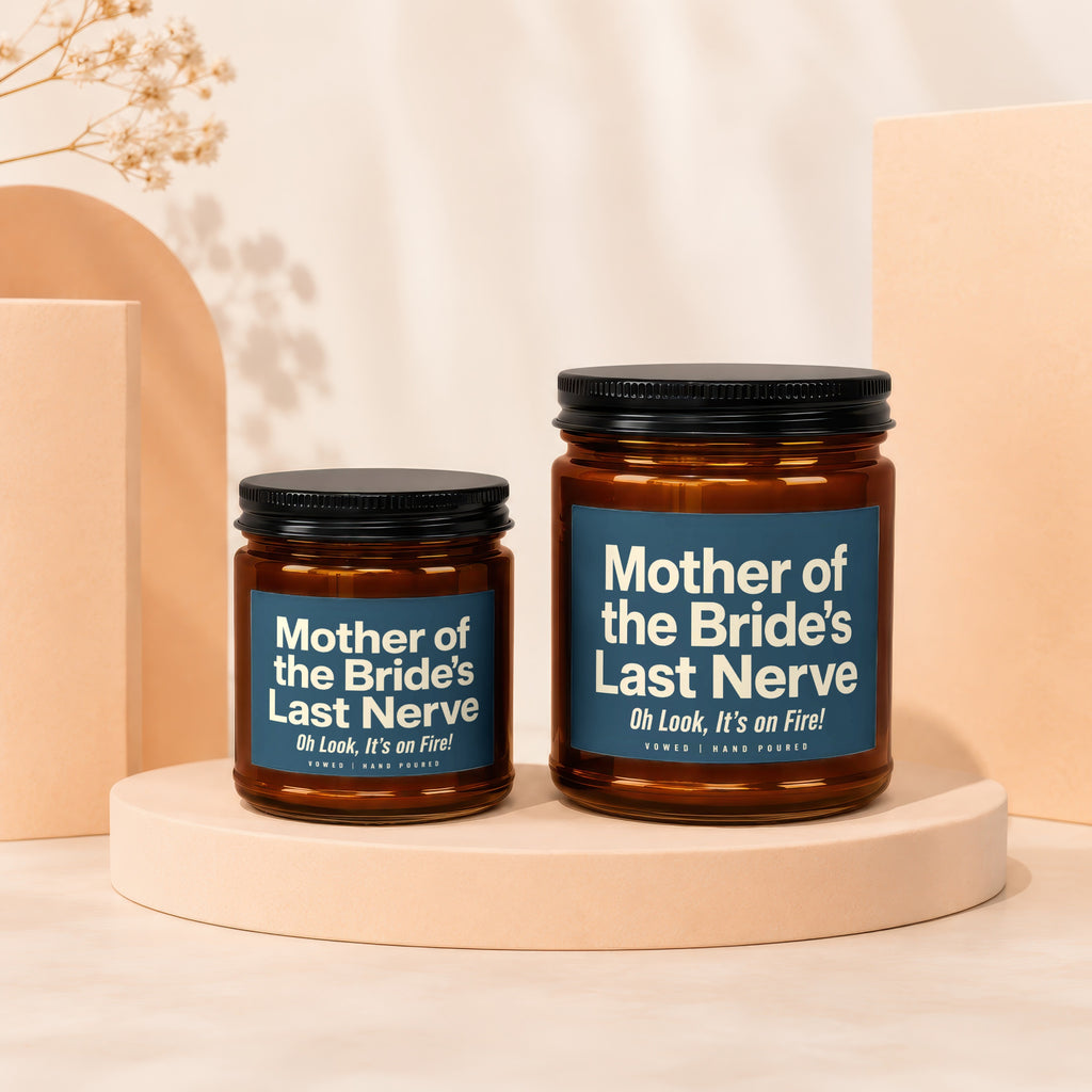 Two amber glass candles with blue labels reading "Mother of the Bride's Last Nerve".