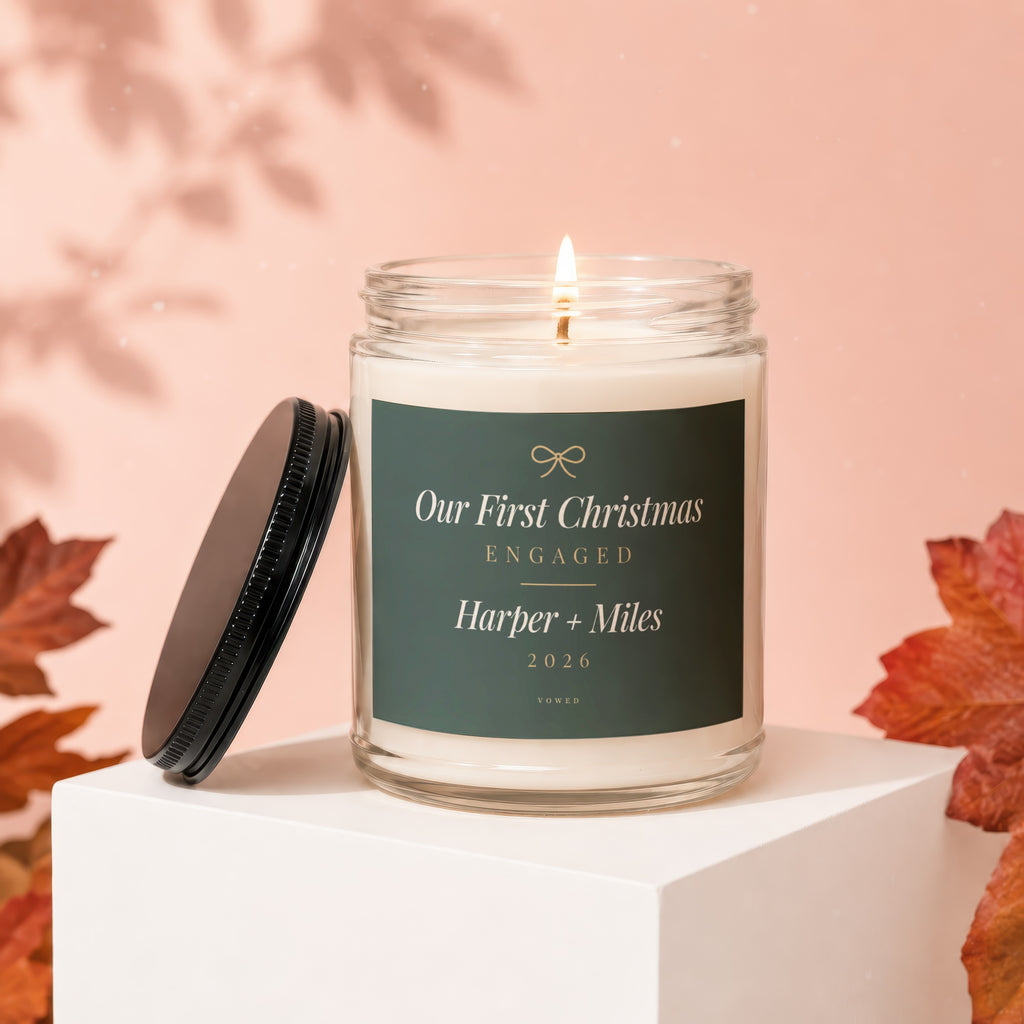 Glass candle labeled "Our First Christmas Engaged Harper + Miles 2026".