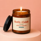 Amber jar candle with lid off, featuring "Ruth + Caleb still no refunds SINCE 2009" text.