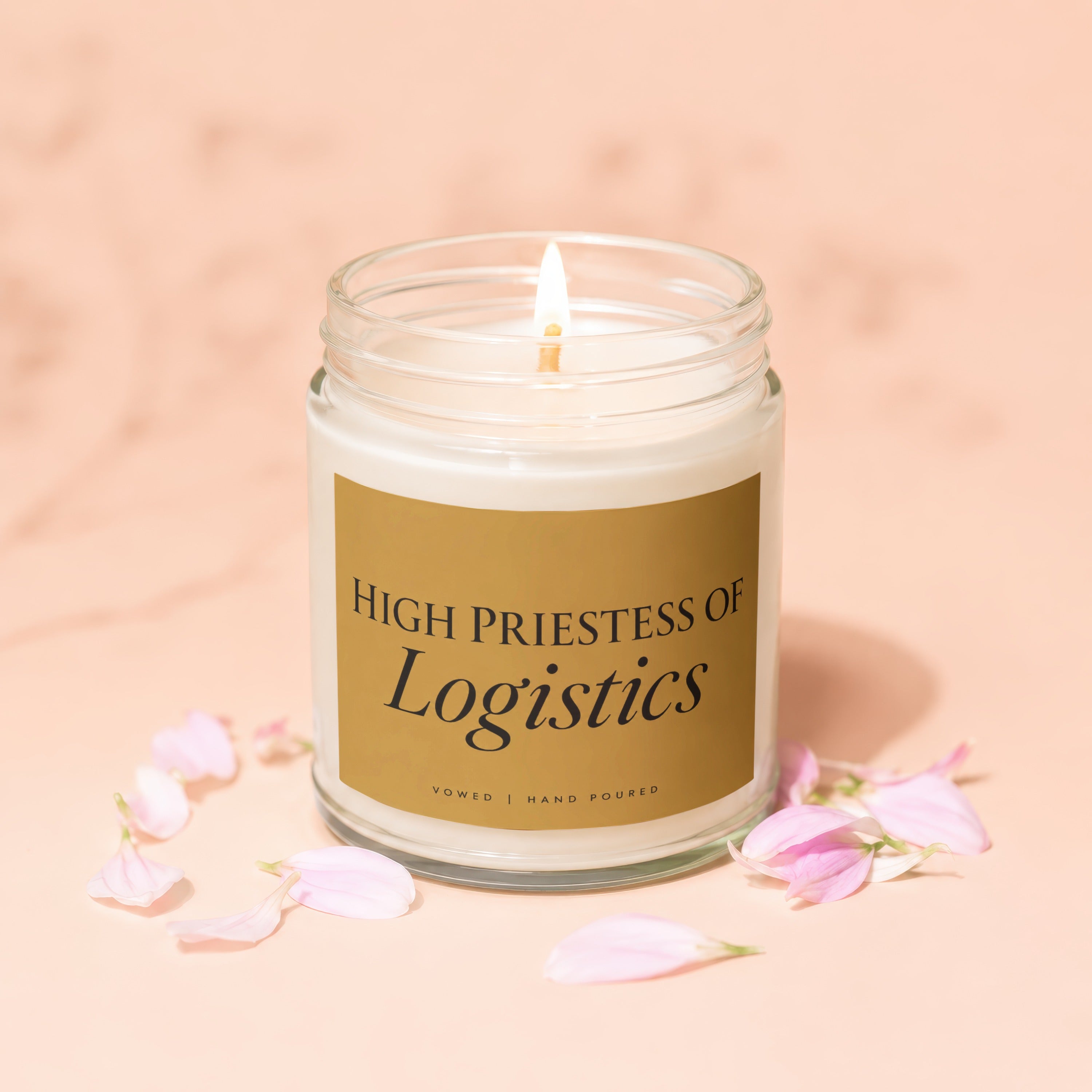 Jar candle with gold label reading "High Priestess of Logistics".