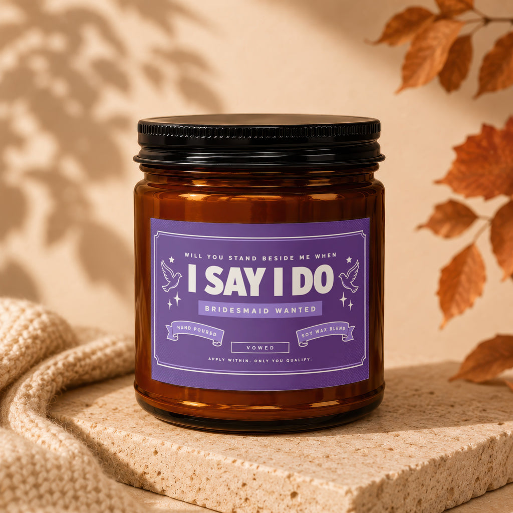 Amber jar candle with "I Say I Do Bridesmaid Wanted" label.