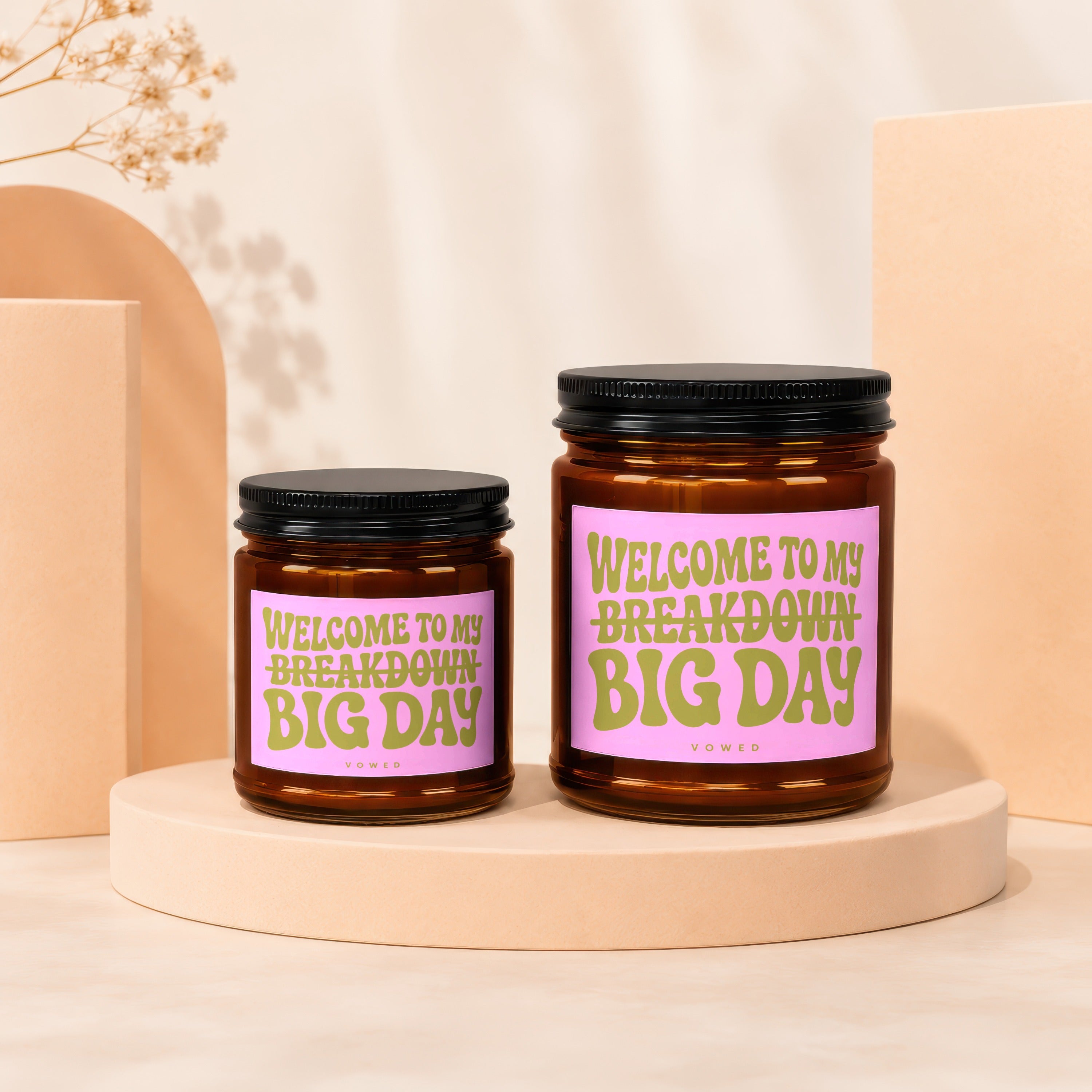 Two amber glass candles with black lids, reading "Welcome to My Breakdown Big Day".
