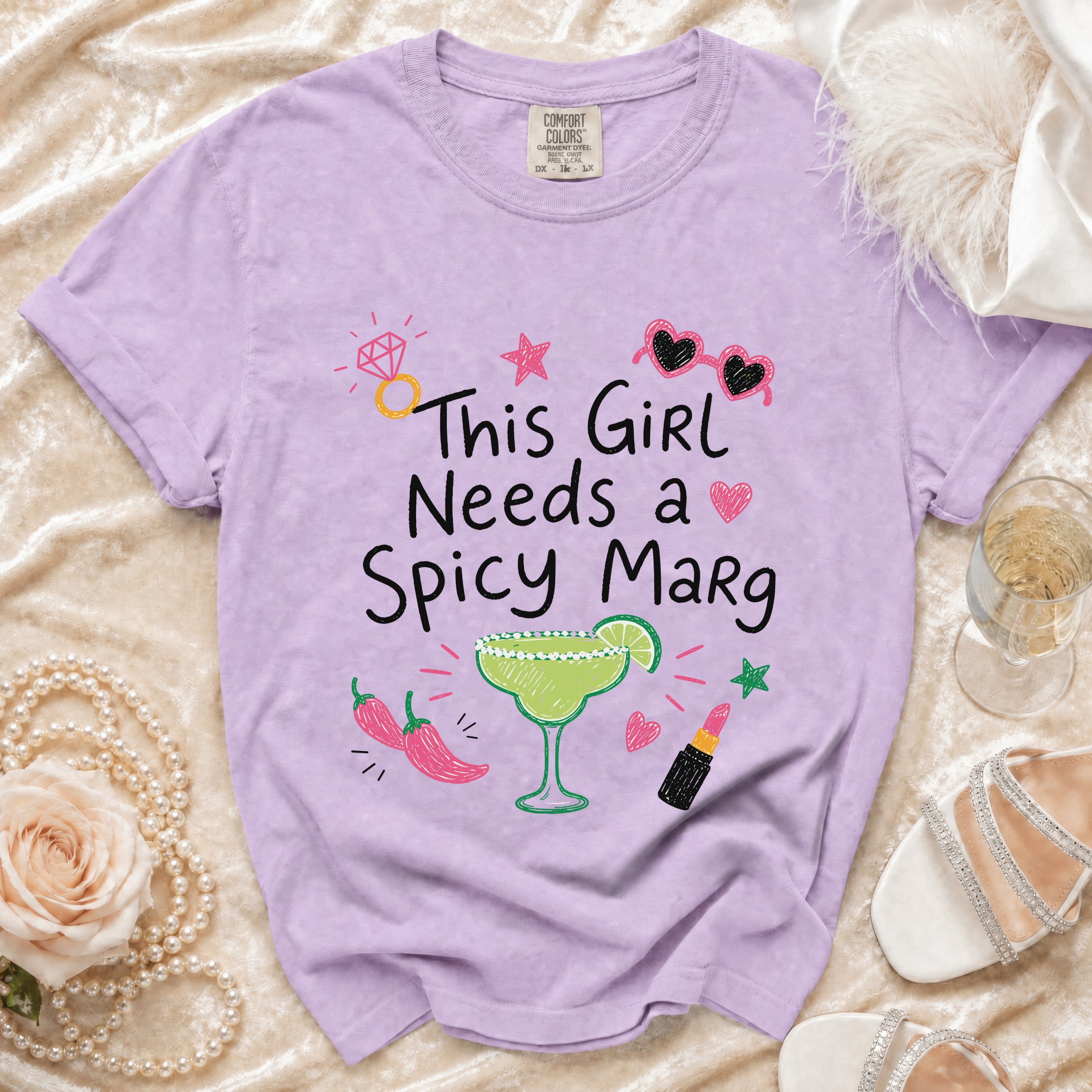 Purple t-shirt with "This Girl Needs a Spicy Marg" text and graphic elements.