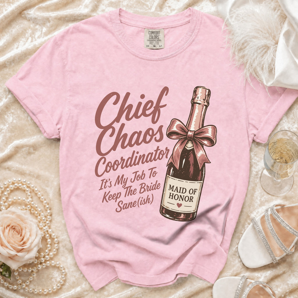 Pink t-shirt with "Chief Chaos Coordinator" text and champagne bottle graphic.