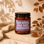Amber candle with pink label reading "Two wives, one Wifi password VOWED".