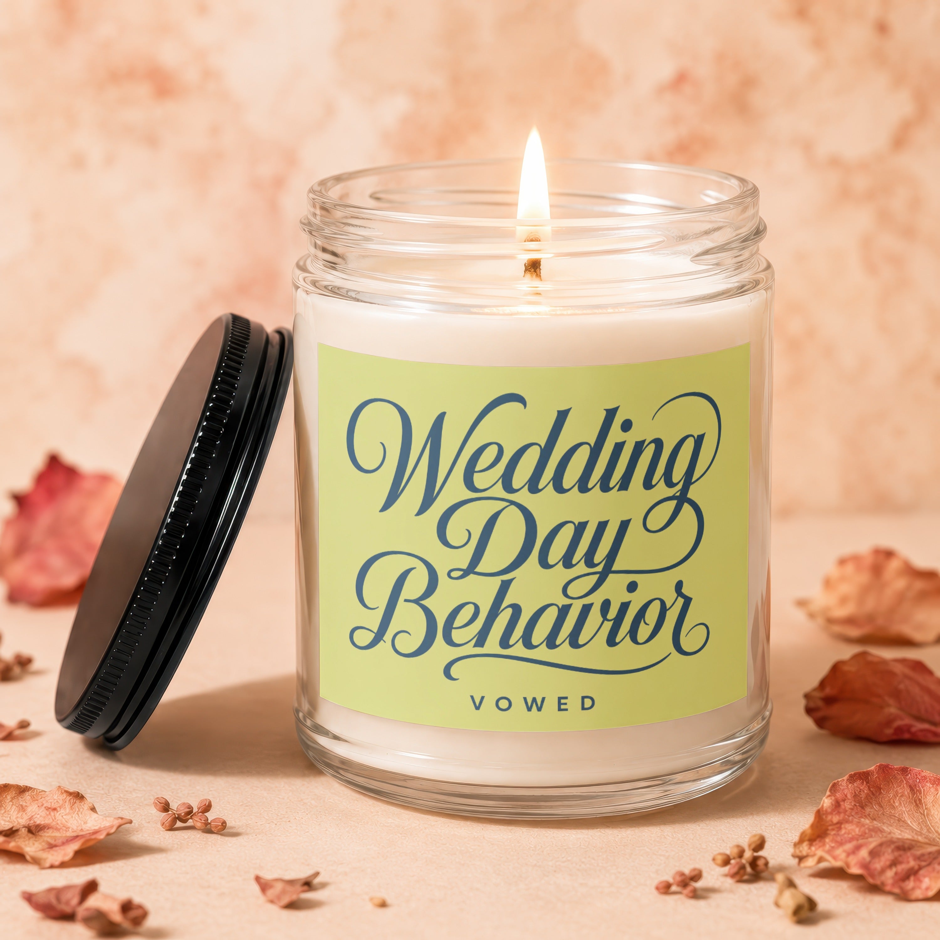Lit candle in a glass jar with "Wedding Day Behavior" and "VOWED" text.