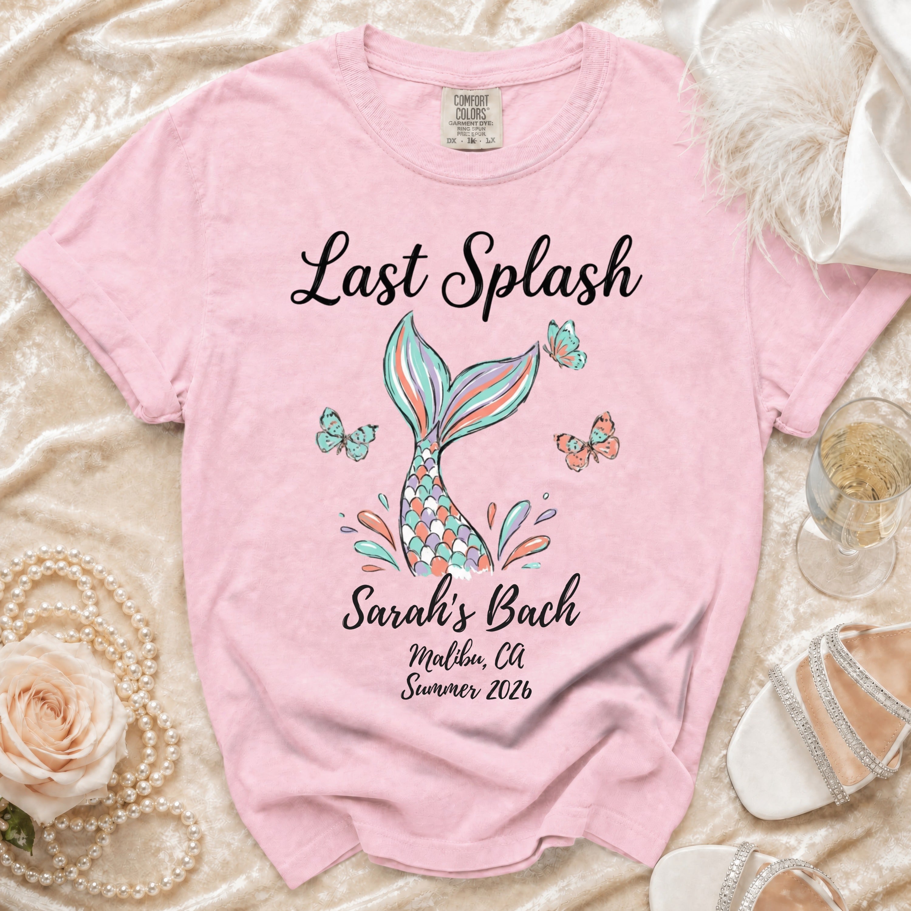 Pink t-shirt with "Last Splash Sarah's Bach Malibu, CA Summer 2026" text and mermaid tail graphic.