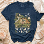 Navy t-shirt with wedding frogs graphic and text "TOADALLY IN LOVE".