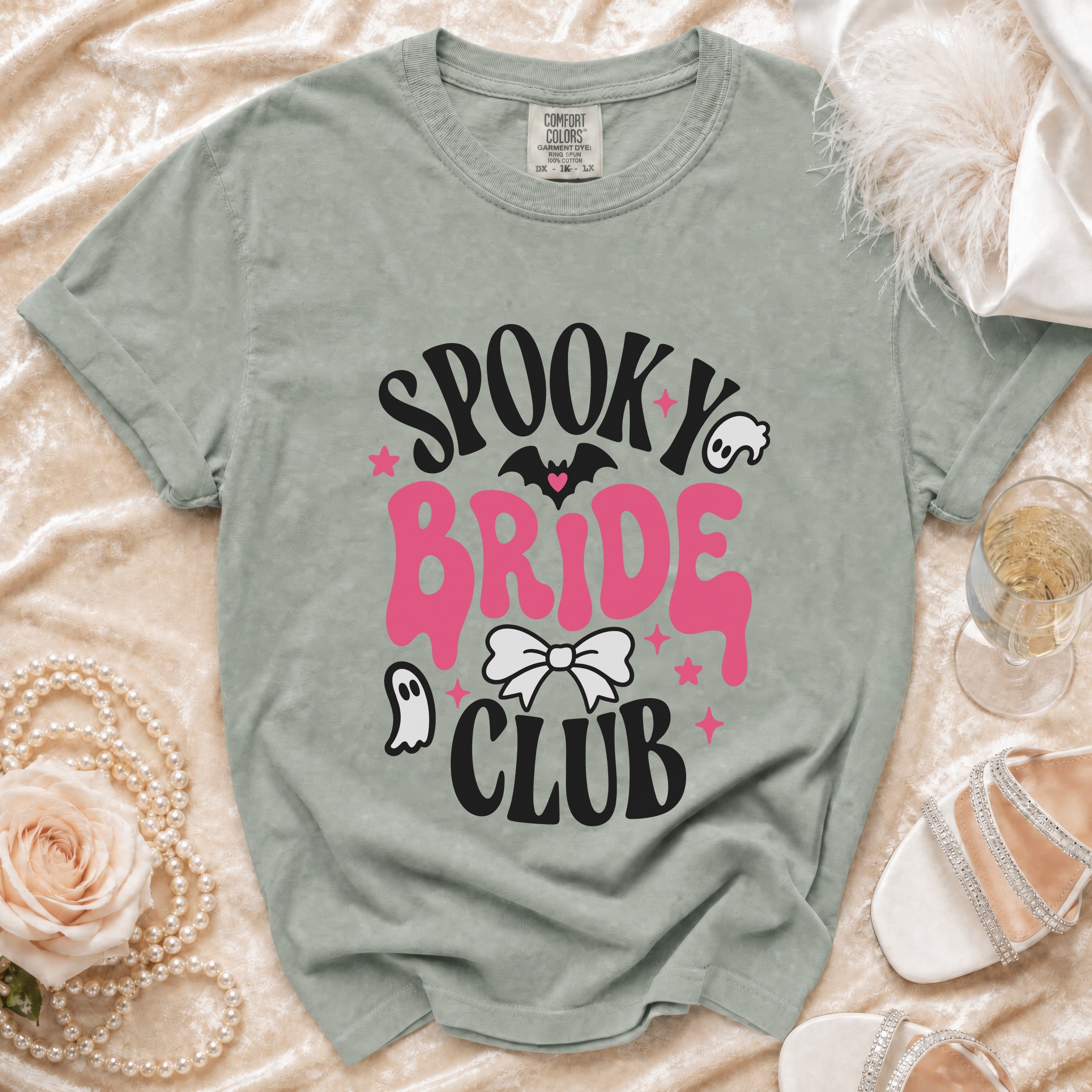 Spooky Bride Club t-shirt with bat, ghost, and bow graphics.