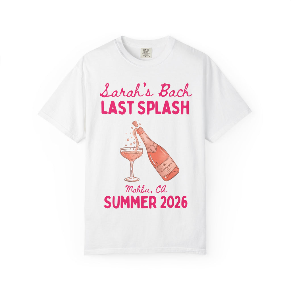 White t-shirt with pink text and champagne bottle graphic.