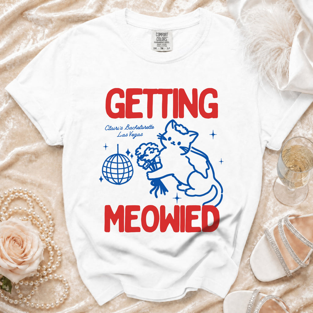 White t-shirt with "GETTING MEOWIED" text, a cat, disco ball, and bachelorette details.