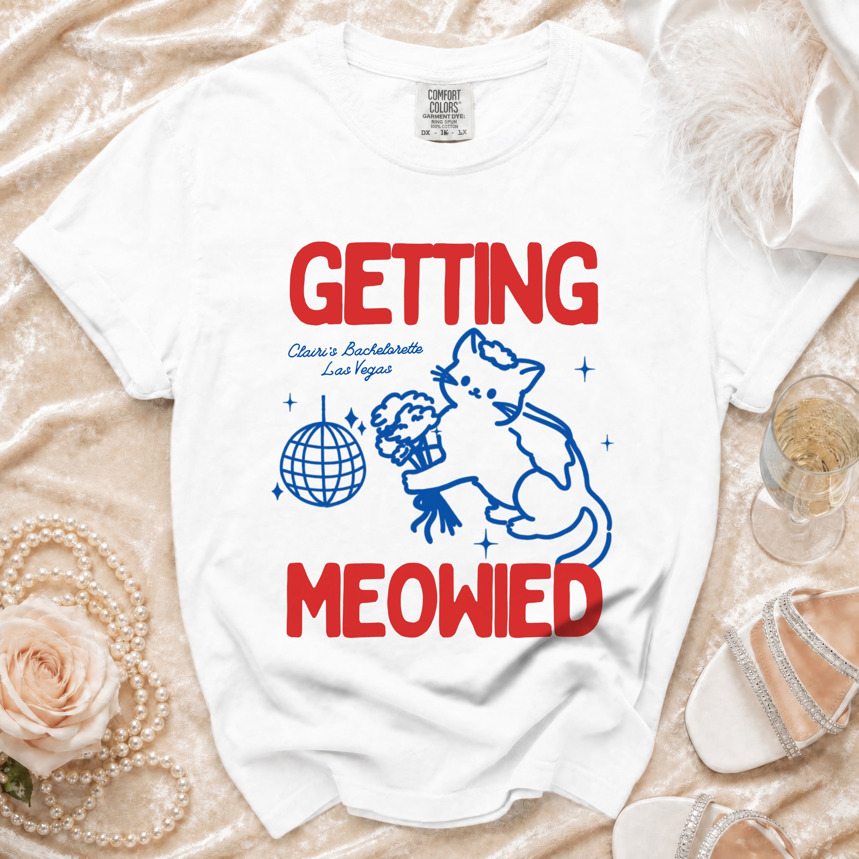 White t-shirt with "GETTING MEOWIED" text, a cat, disco ball, and bachelorette details.