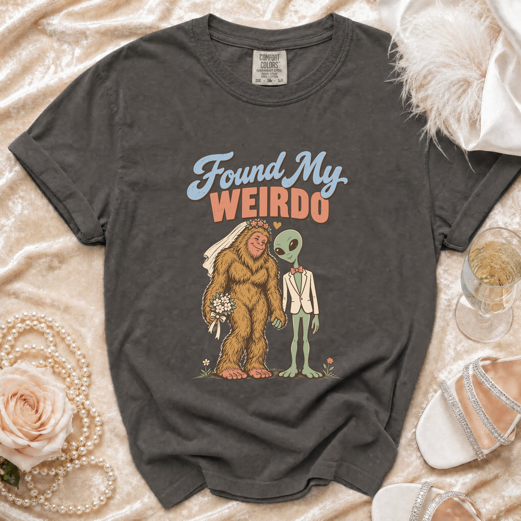 T-shirt with Bigfoot bride and alien groom graphic and "Found My Weirdo" text.