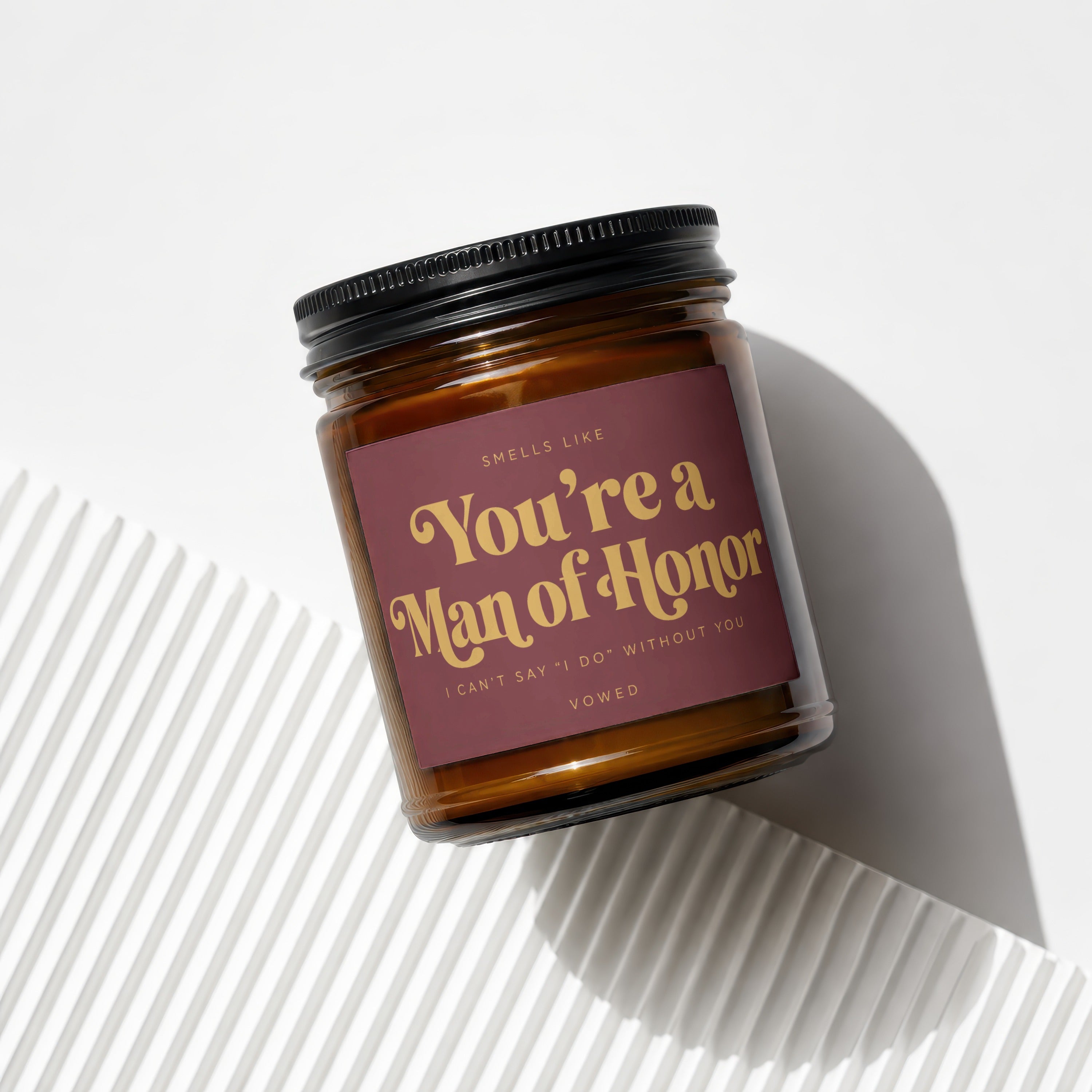 Amber candle with a burgundy label reading "You're a Man of Honor, I Can't Say 'I Do' Without You."