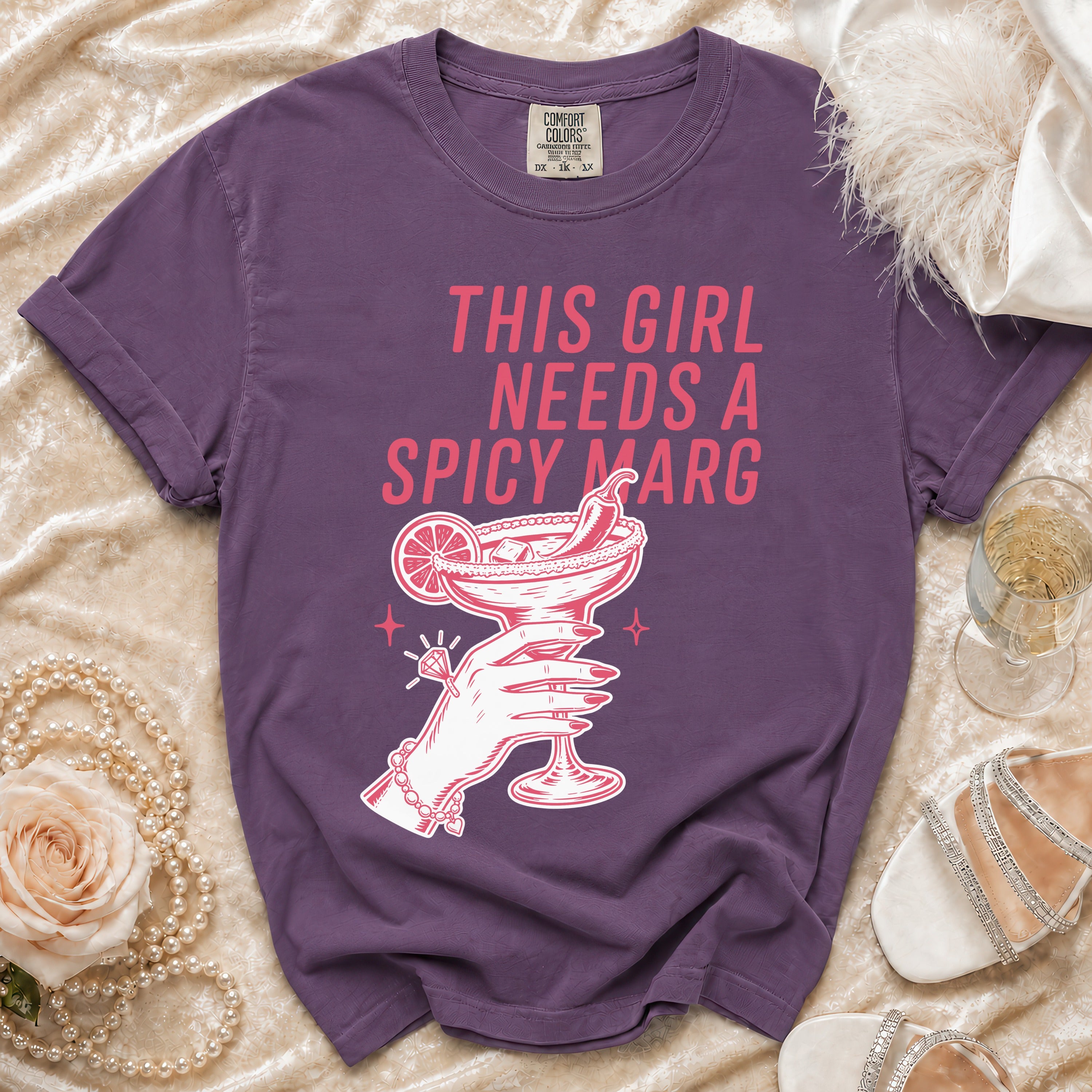 Purple t-shirt with "THIS GIRL NEEDS A SPICY MARG" text and margarita graphic.