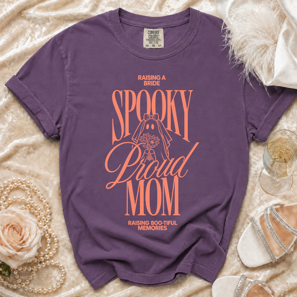 Purple t-shirt with "Raising a Bride Spooky Proud Mom" text and ghost graphic.
