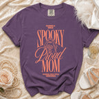 Purple t-shirt with "Raising a Bride Spooky Proud Mom" text and ghost graphic.