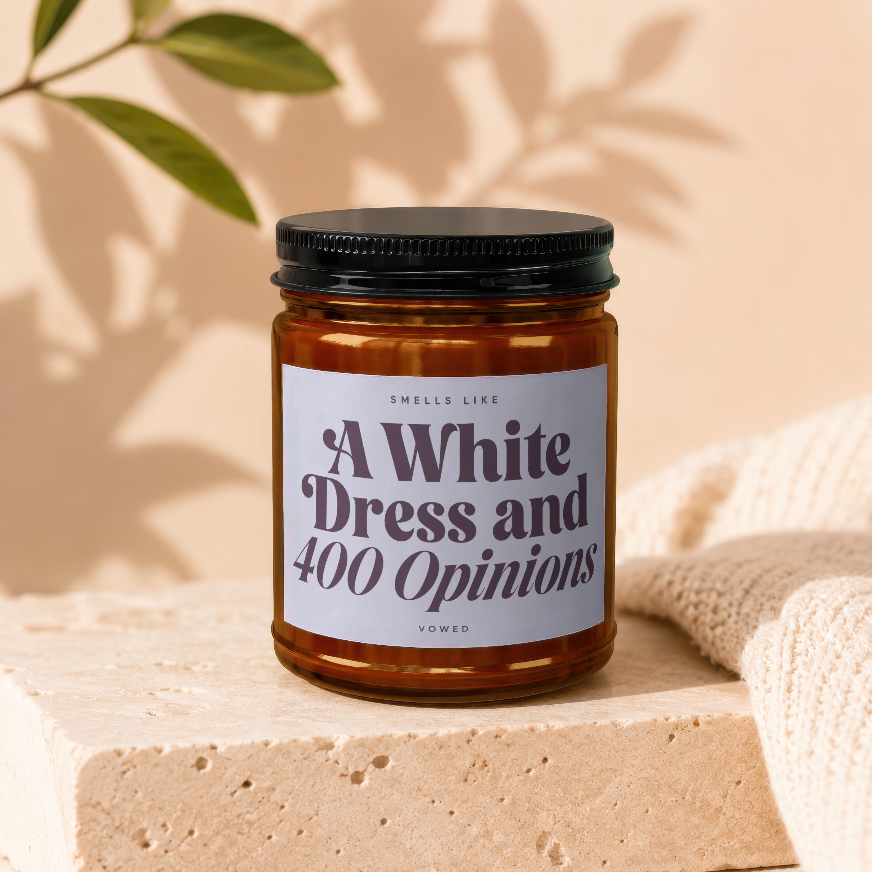 Sells like A White Dress and 400 Opinions candle by Vowed, in amber glass jar.
