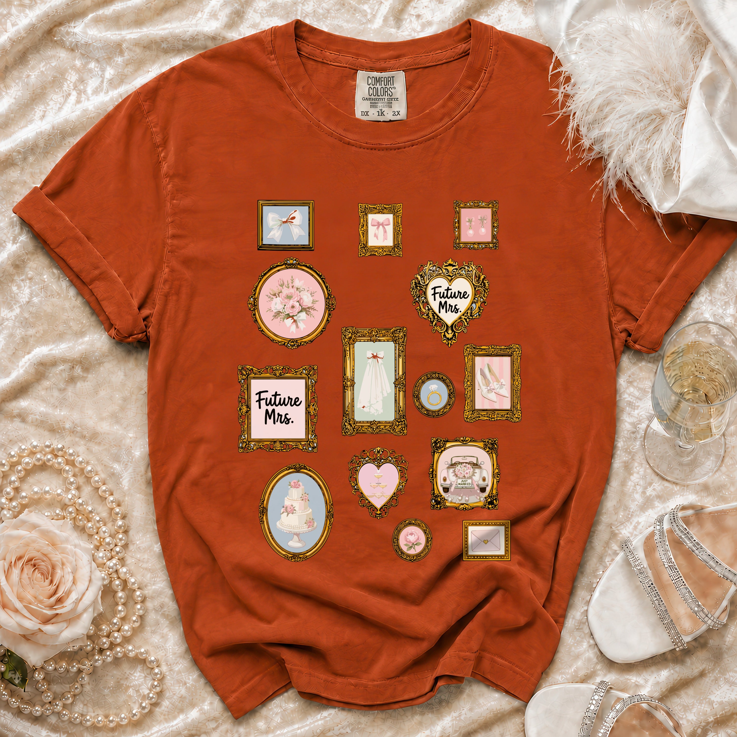 Orange t-shirt with framed wedding illustrations including "Future Mrs." and a wedding cake.