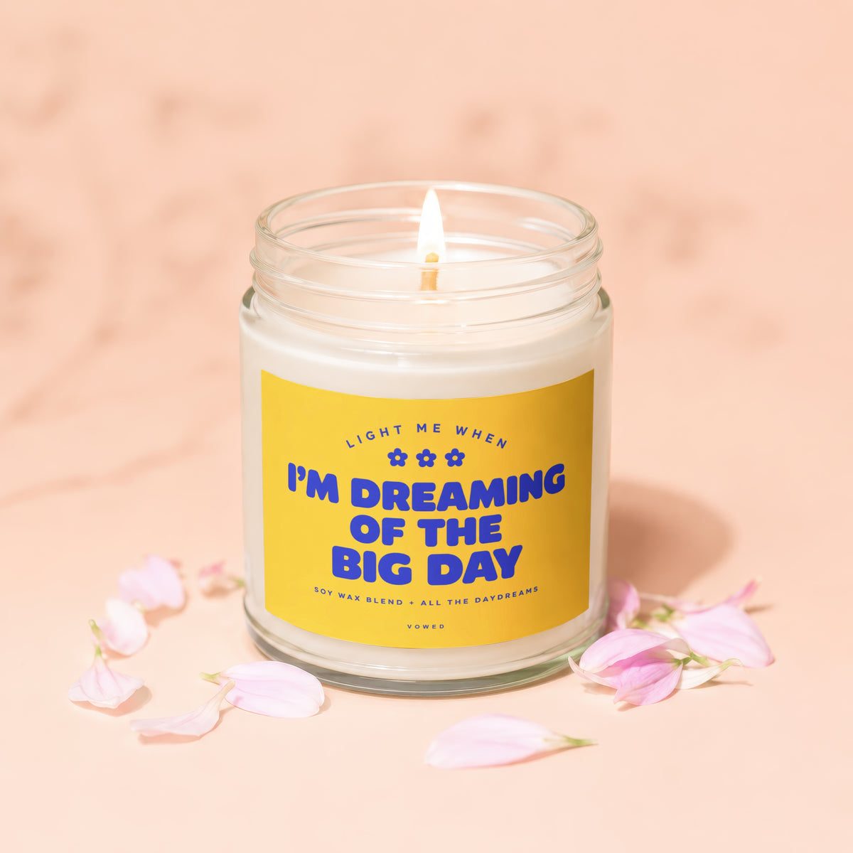 Lit candle in jar with yellow label saying "I'm Dreaming of the Big Day".