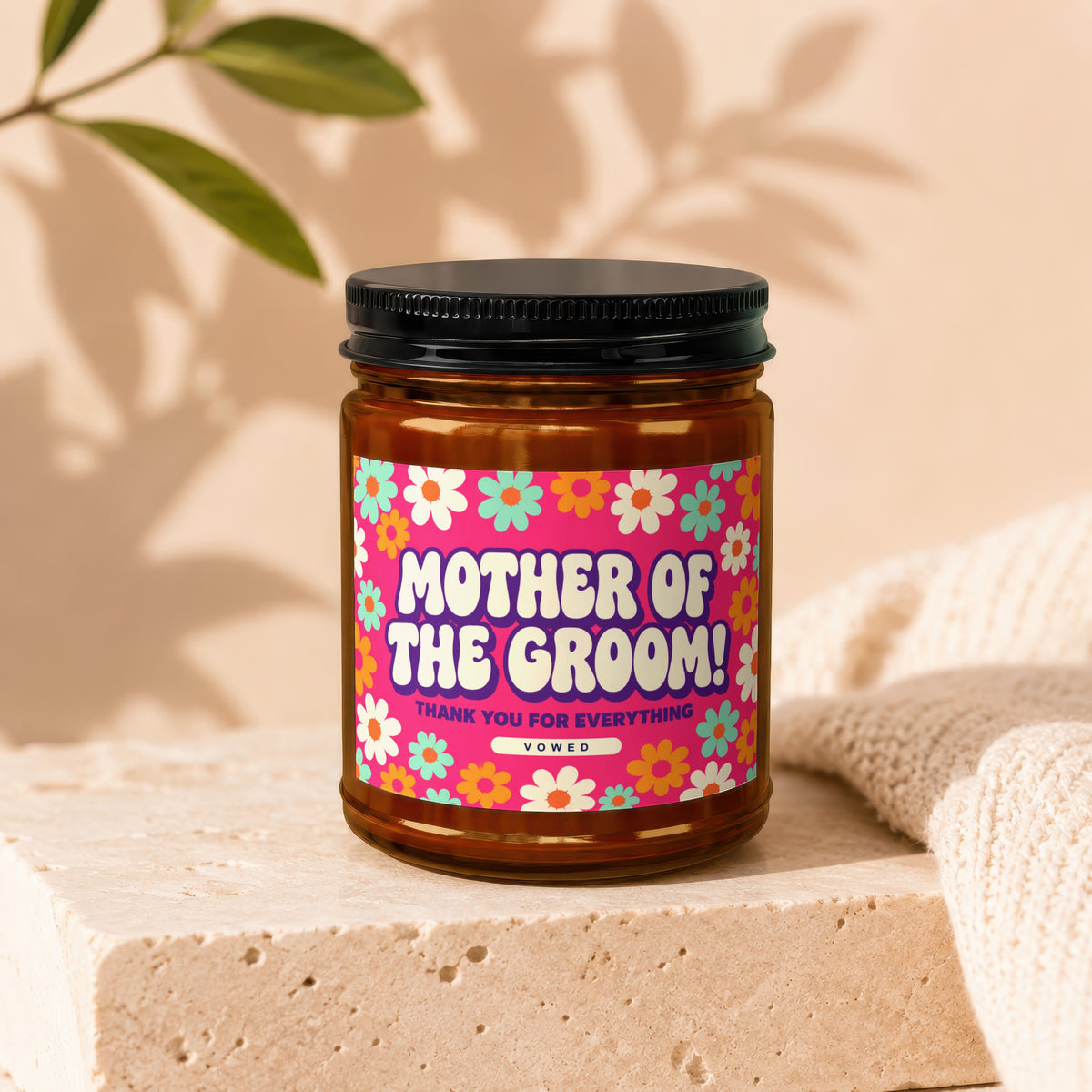 Amber jar with black lid, decorated with "Mother of the Groom" and floral pattern.
