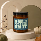 Candle with text "Smells like He finally put a ring on it."