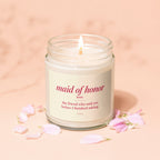 Candle with "Maid of Honor" definition and pink flower petals.
