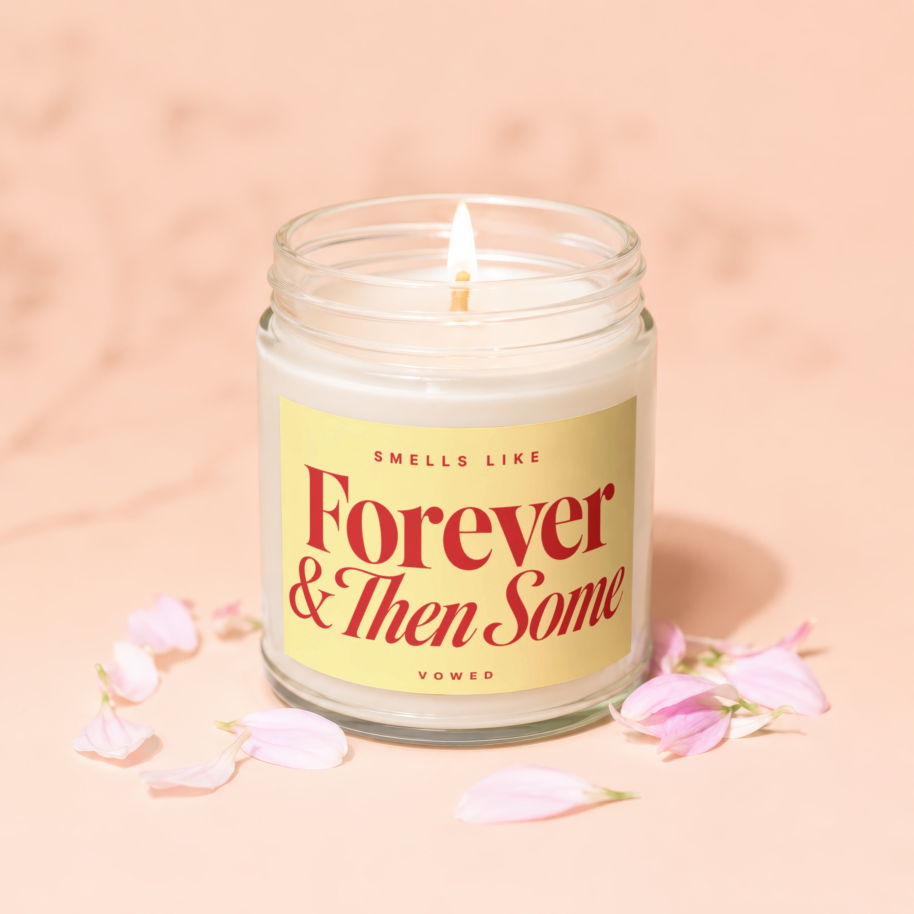 lit candle in jar with label "Smells Like Forever & Then Some Vowed"