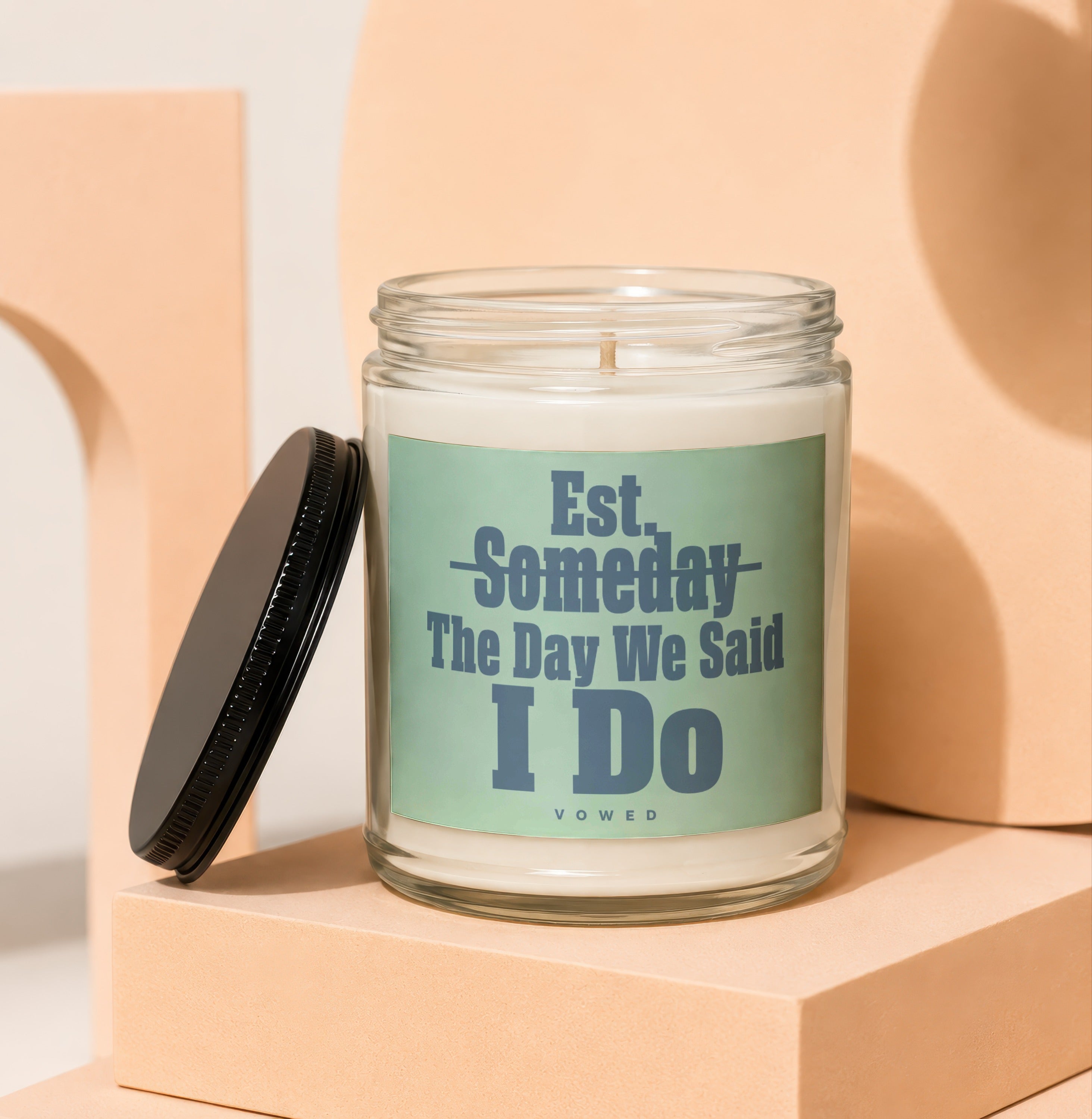 Glass candle with "Est. Someday The Day We Said I Do" text.