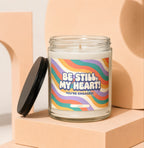 Glass candle with "Be Still, My Heart! You're Engaged!" text on wavy rainbow label.