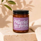 Amber jar candle with lilac label reading "Married my person vowed."
