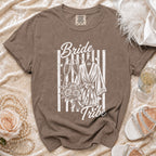 Brown t-shirt with "Bride Tribe" graphic, champagne glasses, and robe.