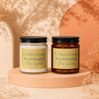 Two candles with "It's Not Crying, It's Allergies, It's Love" labels.