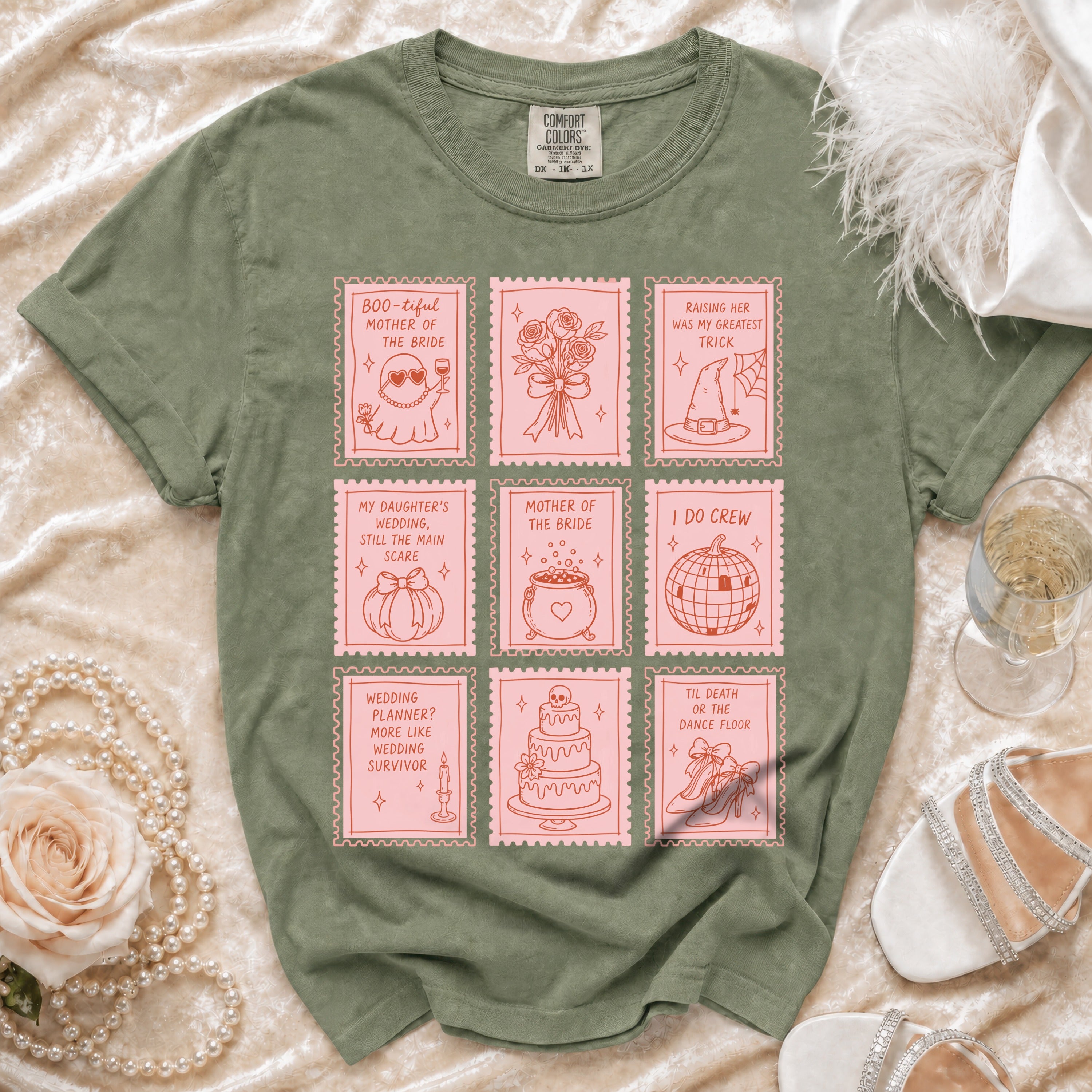 Green t-shirt with pink stamp designs of wedding and Halloween-themed illustrations and text.