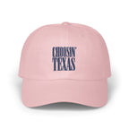 A pink baseball cap featuring embroidered navy blue text that reads CHOOSIN TEXAS on the front.