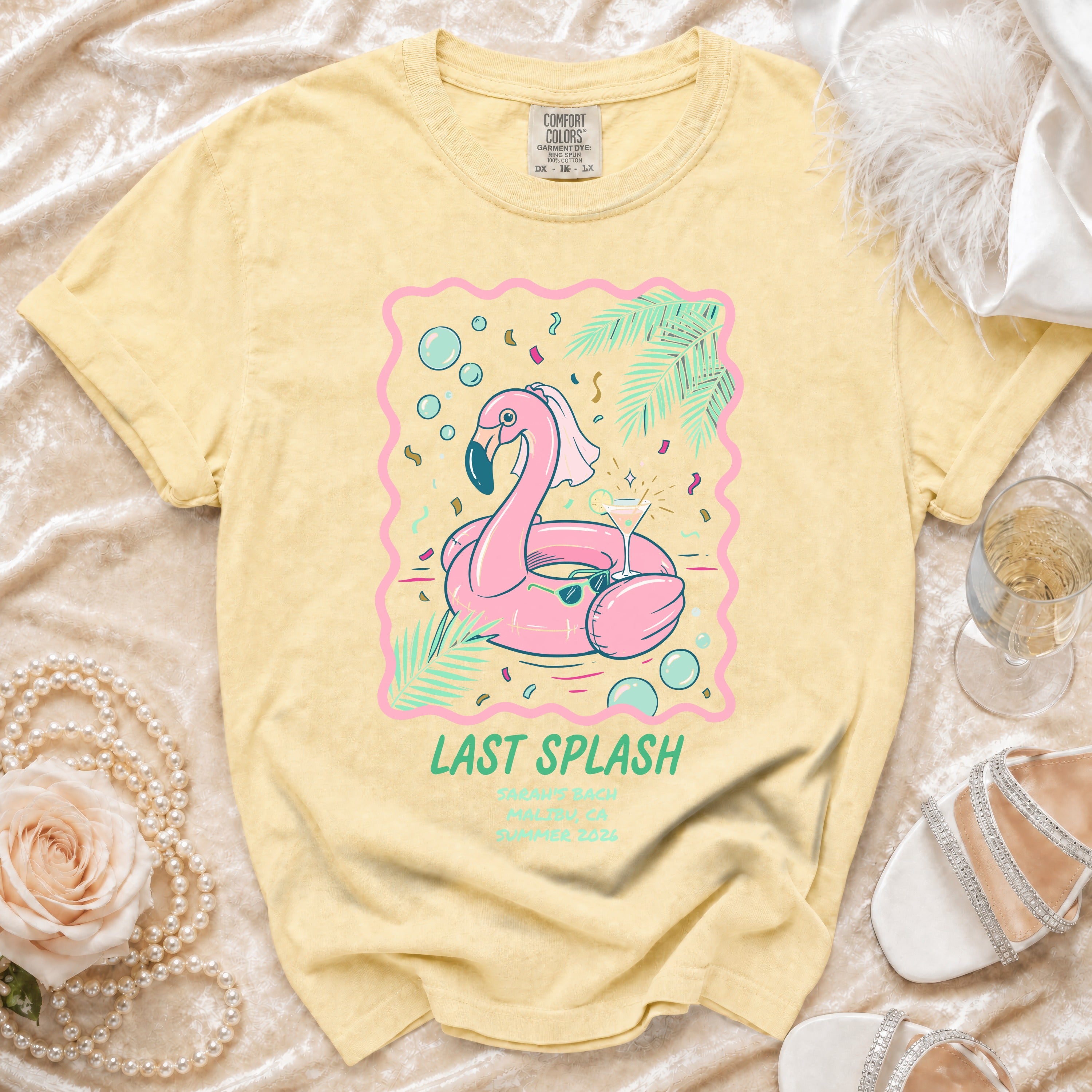 Yellow t-shirt with pink flamingo graphic and "Last Splash" text.