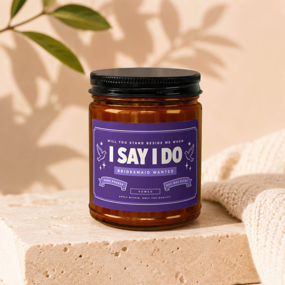 Candle with "I Say I Do" and "Bridesmaid Wanted" label, soy wax blend.