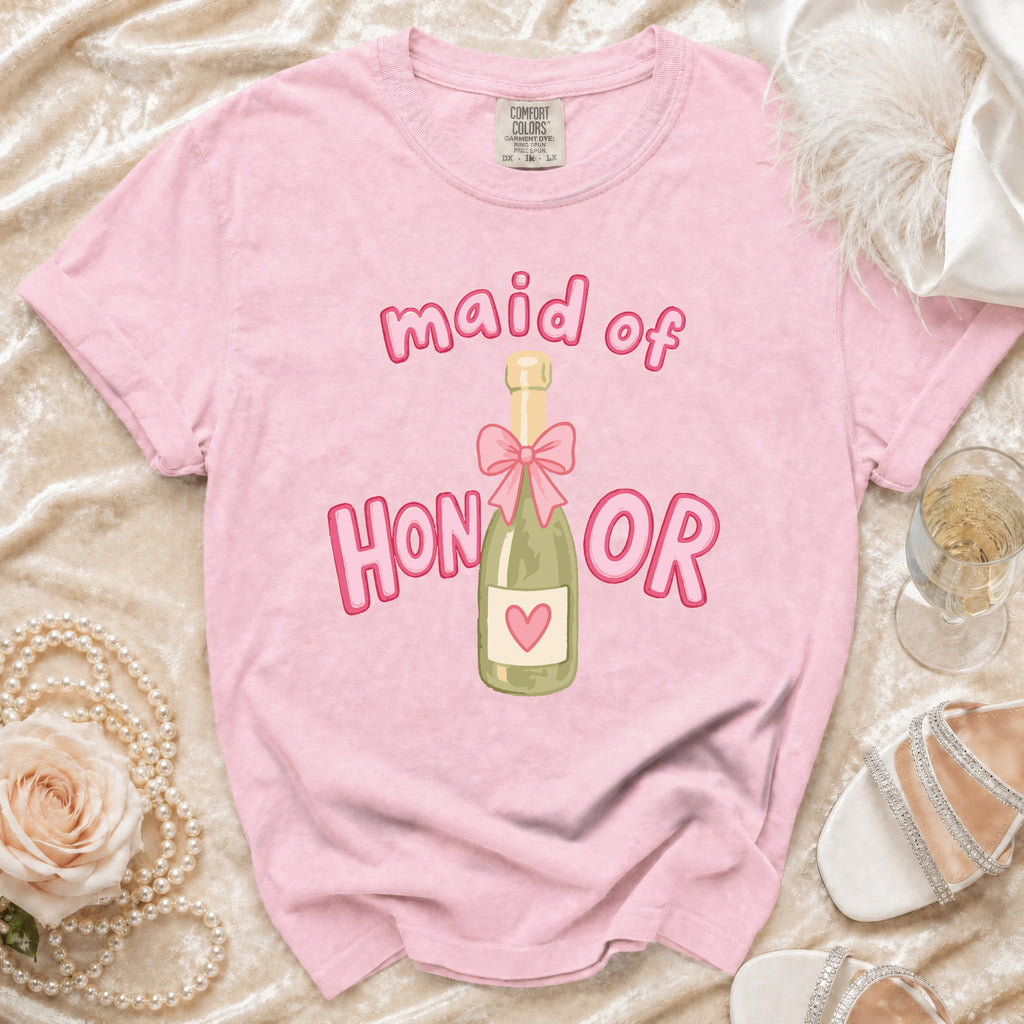 Pink t-shirt with "Maid of Honor" text and champagne bottle graphic.