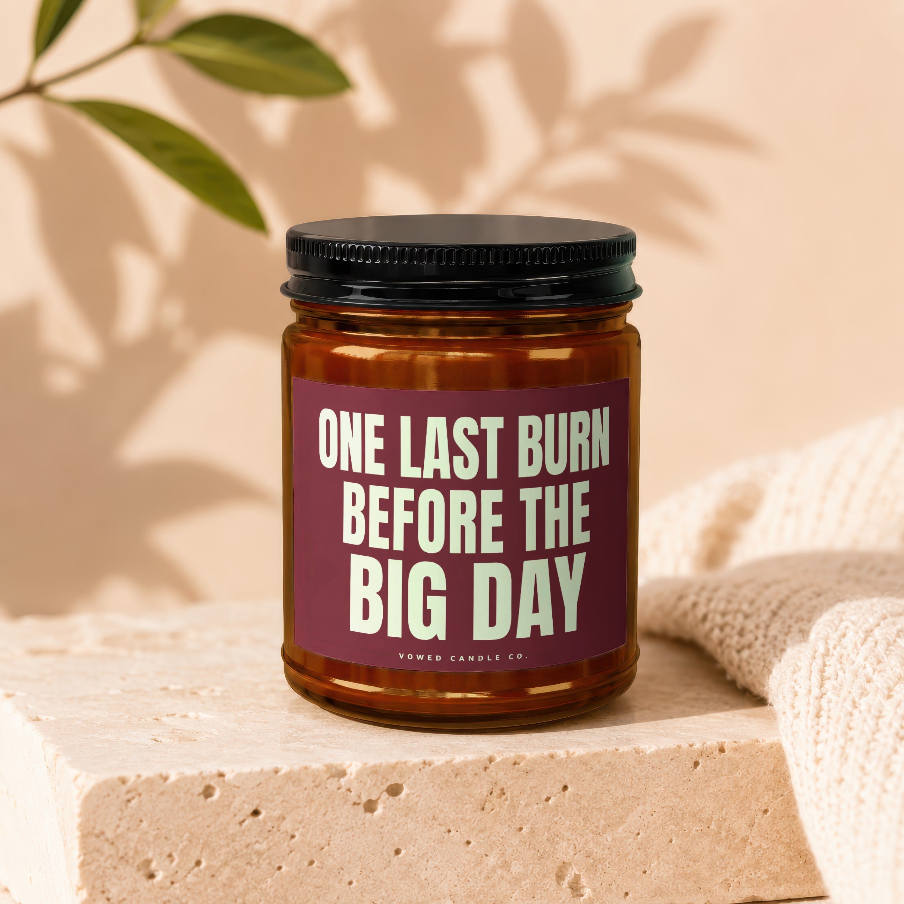 Candle with text "ONE LAST BURN BEFORE THE BIG DAY" on a stone block.